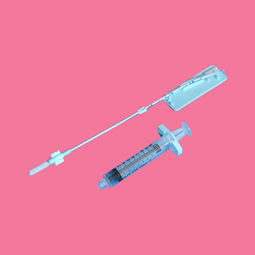 Suction curette with syringe